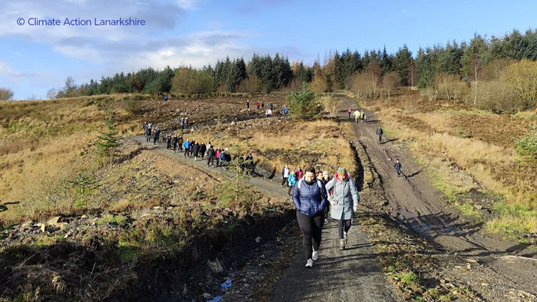 This image shows people walking on the new active travel path which links the National Cycle Network Route 74 (NCN74) to the villages of Coalburn and Douglas, providing an essential connection to Lesmahagow and beyond