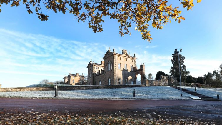 This is a landscape image of the hunting lodge in autumn at Chatelherault taken from the front grounds.