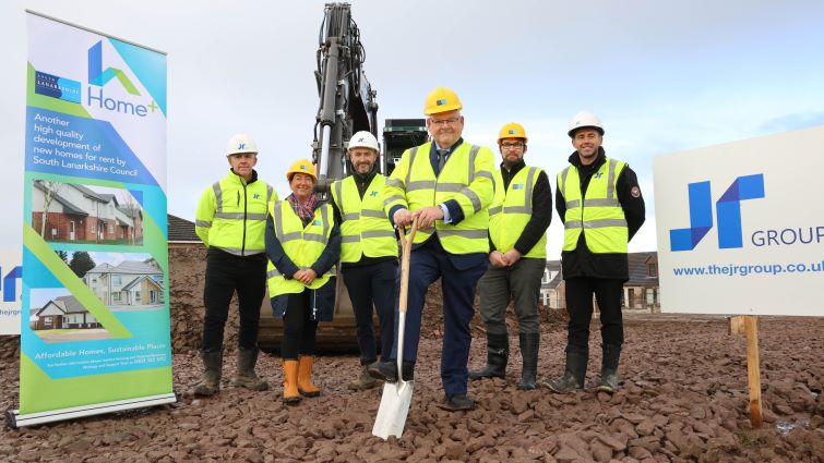 This image shows Councillor Davie McLachlan with council representatives and reps from The JR Group to signal the start of the work on new council homes in Reid Street, Hamilton