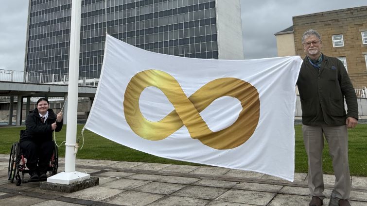 Flag flies high to support autism pride