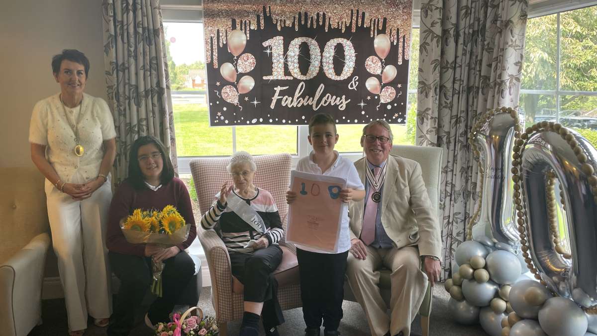 Margaret Armour celebrates her 100th with pupils from nearby Beckford Primary School