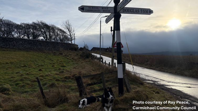The restored way-marking sign at Carmichael village.
